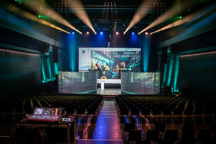 A formal stage setup featuring a spacious screen and a prominent stage.